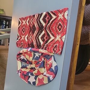 Two women's infinity scarfs. Colores red black and blue.